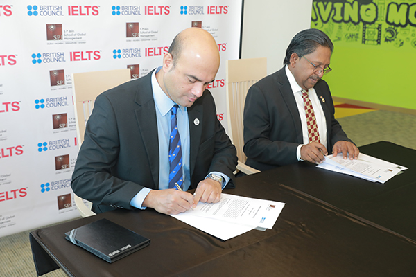 Deep Adhikari, Director Examinations Gulf South Cluster,<br>British Council UAE, and Prof Christopher Abraham, Professor and Head of Campus (Dubai), SP Jain, sign the MoU