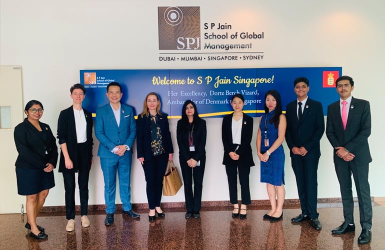 Her Excellency, Dorte Bech Vizard, Ambassador of Denmark (centre with brown bag) with the SP Jain staff and Student Ambassadors
